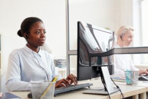 African-American Operator Working in Customer Support Center