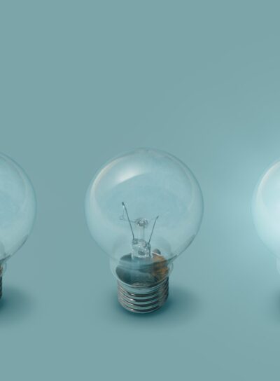 One lit bulb next to unlit bulbs